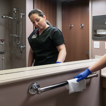 Environmental Services Wiping Bathroom